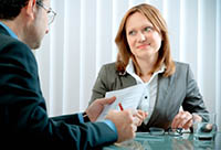 Man and Woman Conducting a Job Interview - Peter Barron Stark Companies