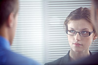 Quiet business woman listening to negotiation counterpart