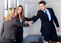 A business woman introducing another woman to a business man - negotiation - Peter Barron Stark Companies